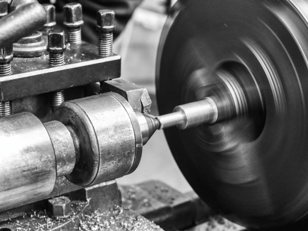 Old lathe - Industrial machines in a old factory - black and whi